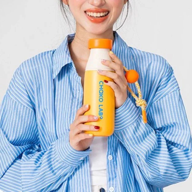 Chako Lab MilkMate 520ML Ceramic-Coated Tumbler in Glow Peach with dual lids on white background
